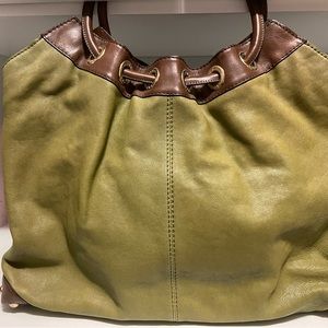 Michael Kors bag in green and brown.  Used 2 or 3 times.